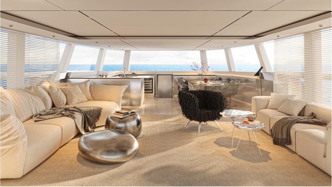 The main salon — deep sofas, sea on three sides