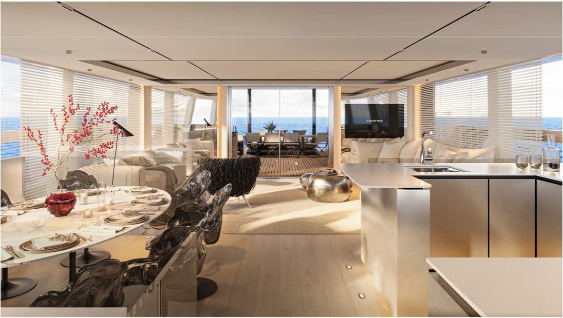 The salon looking through to the dining table and galley island